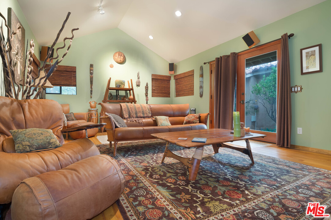 29660 Harvester Road Malibu, CA 90265 - Photo 26 of 32 a living room with furniture and a large window