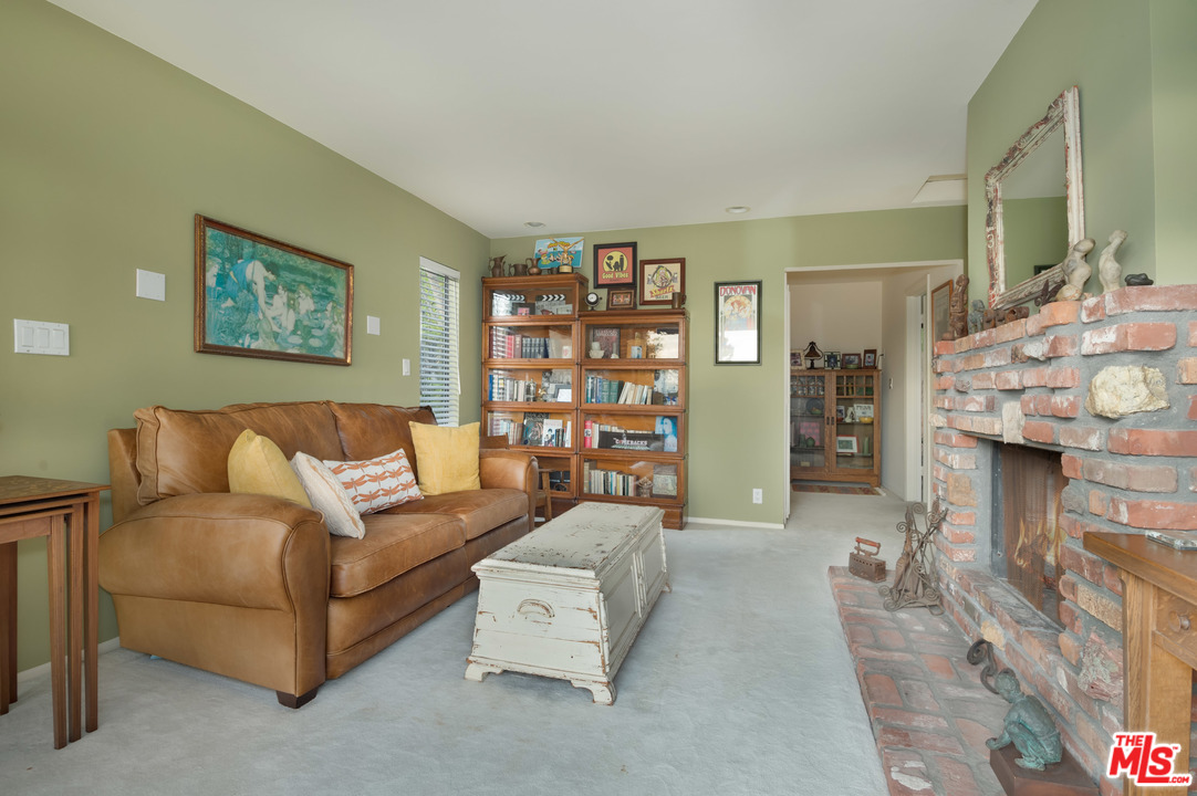 29660 Harvester Road Malibu, CA 90265 - Photo 27 of 32 a living room with furniture and a fireplace