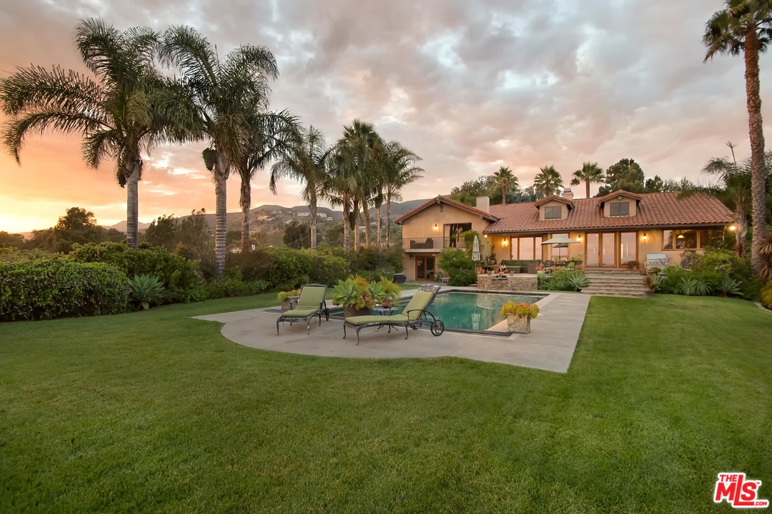 29660 Harvester Road Malibu, CA 90265 - Photo 30 of 32 a view of a house with garden and patio