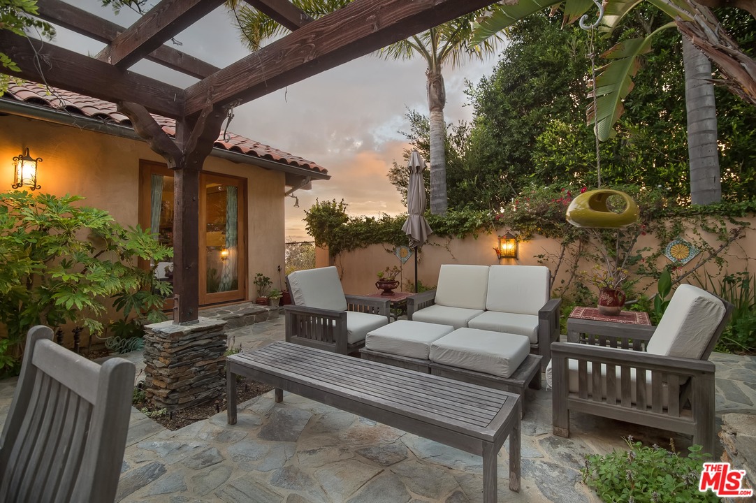 29660 Harvester Road Malibu, CA 90265 - Photo 9 of 32 a outdoor living space with furniture and a fireplace