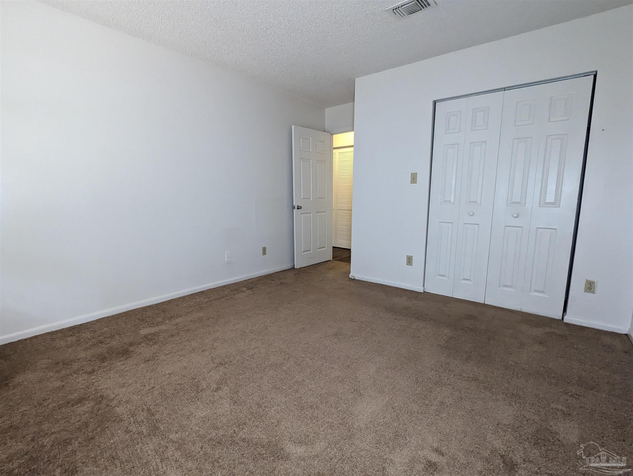 6288 Hamilton Bridge Road, Unit 301 Milton, FL 32570 - Photo 14 of 24 a view of an empty room