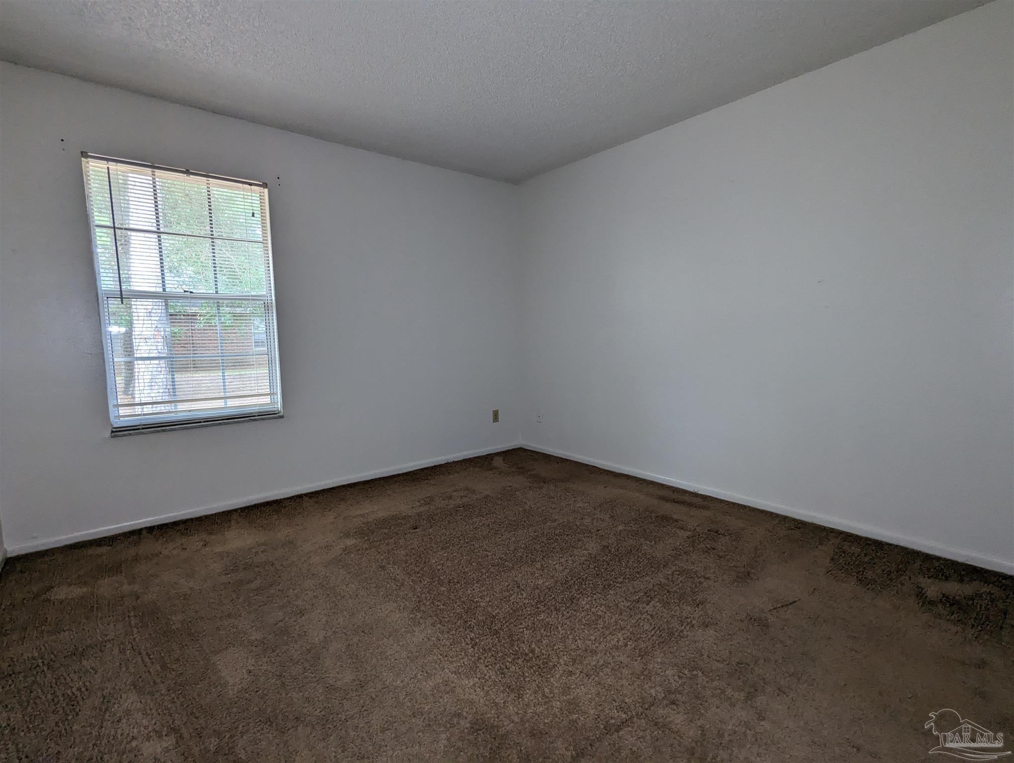 6288 Hamilton Bridge Road, Unit 301 Milton, FL 32570 - Photo 16 of 24 an empty room with a window