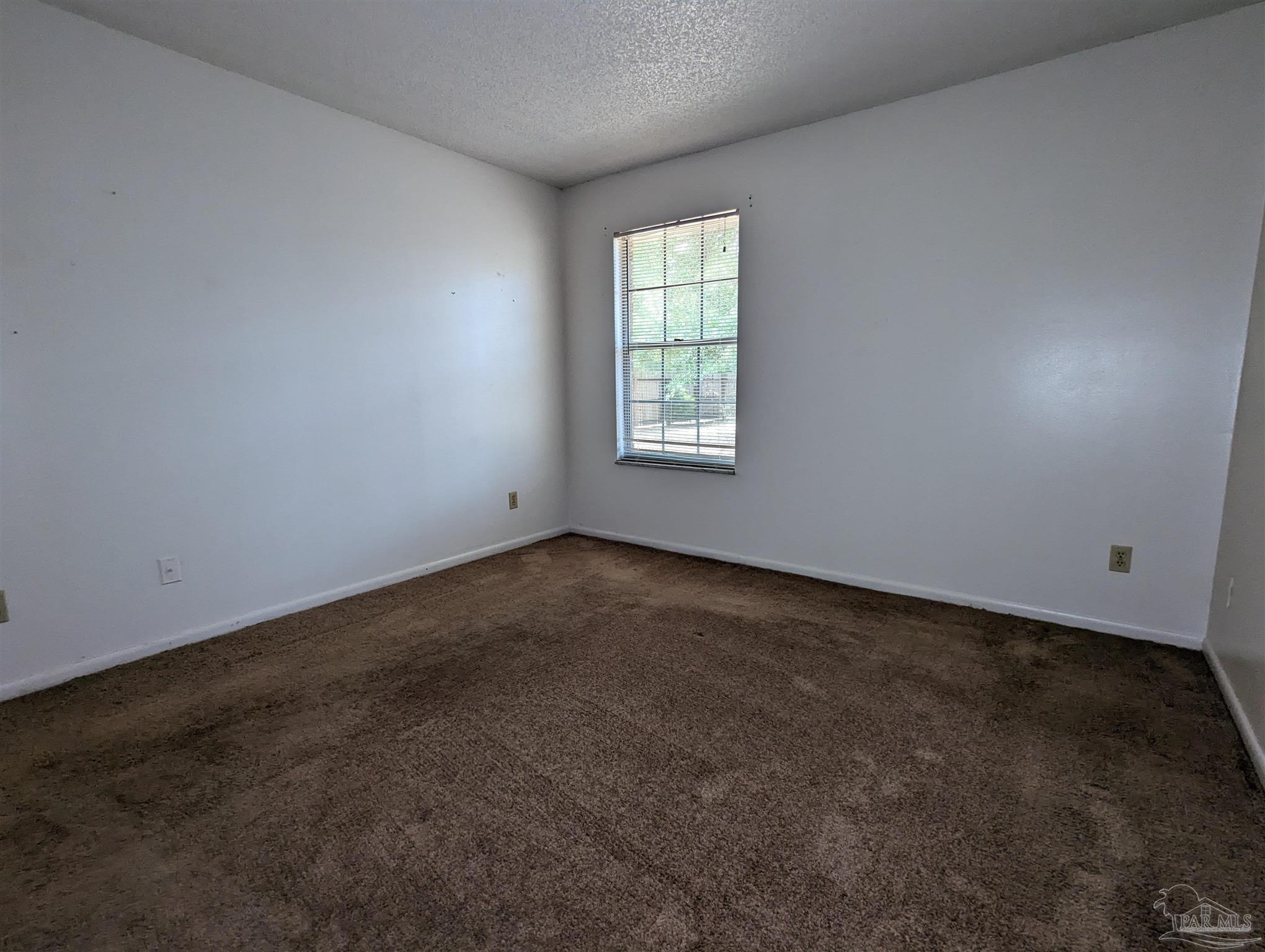 6288 Hamilton Bridge Road, Unit 301 Milton, FL 32570 - Photo 19 of 24 an empty room with a window