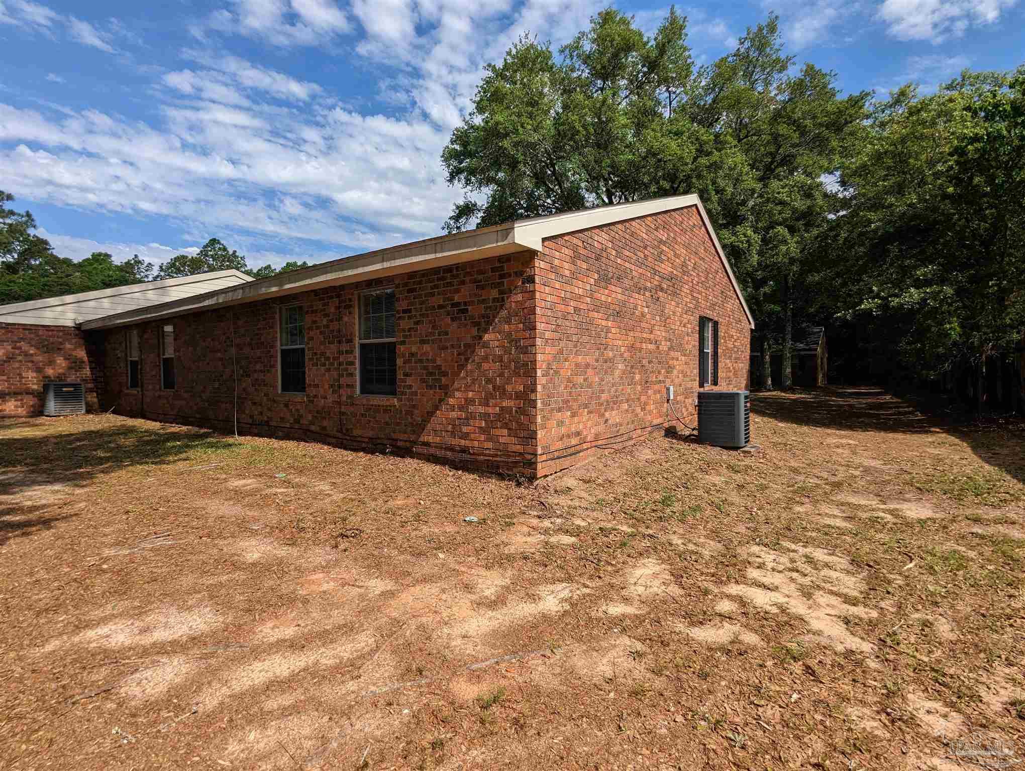 6288 Hamilton Bridge Road, Unit 301 Milton, FL 32570 - Photo 24 of 24 a backyard of a house with lots of green space