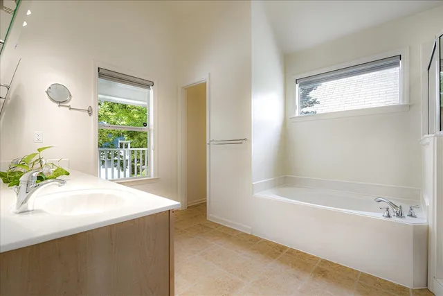 a bathroom with a bathtub and a sink