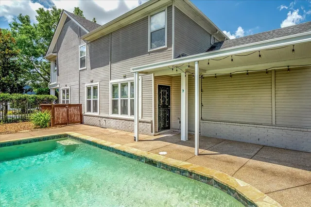 a view of a garden with a house