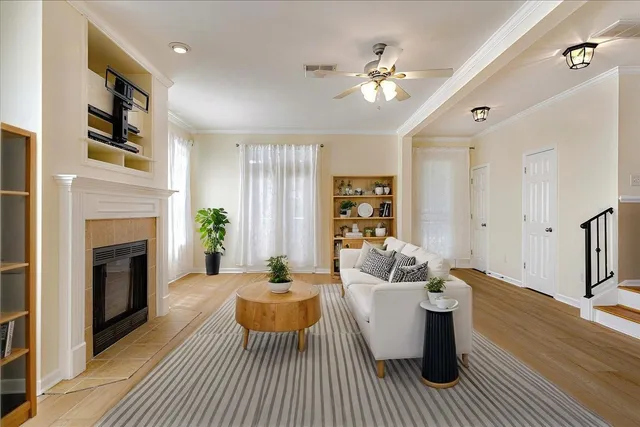 a living room with furniture and a fireplace