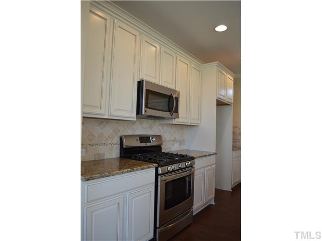 933 Palace Garden Way Raleigh, NC 27603 - Photo 12 of 25 Gas Range, Custom Tile Backspash, Gorgeous Granite, 42' Cabinets Kitchen