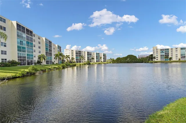 a view of a lake with tall building