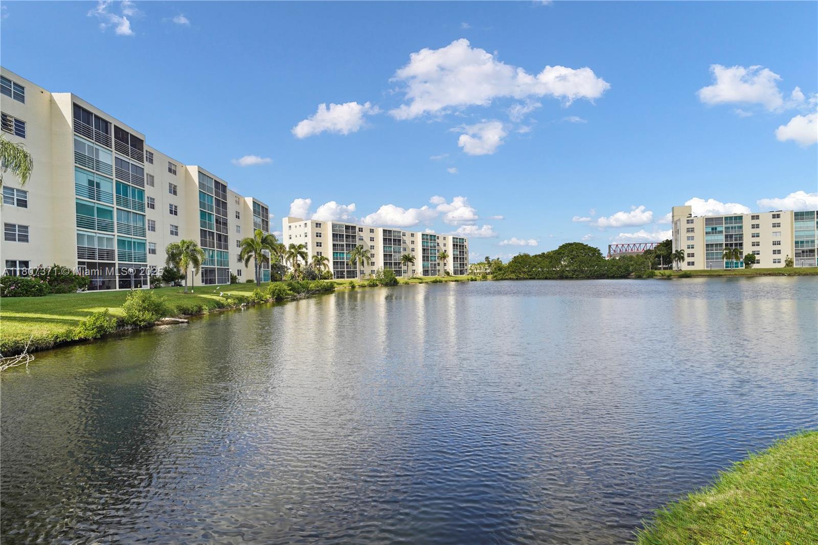 a view of a lake with tall building