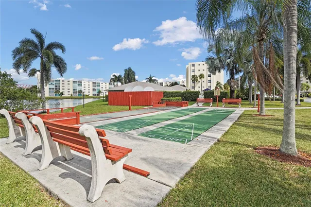 a view of a backyard with palm trees