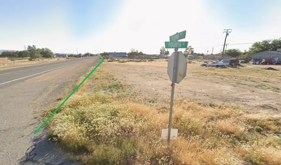 a view of a street with an ocean view
