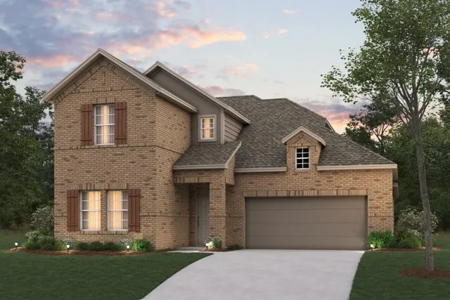 a front view of a house with a garden and garage
