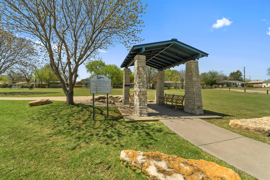 1025 Stonehaven Lane Crowley, TX 76036 - Photo 11 of 16 a backyard of a house with lots of green space and fountain