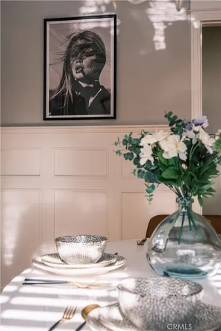 a large bed sitting in a bedroom next to a window