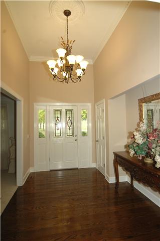 Glistening hardwoods greet you as you enter this spacious country home.