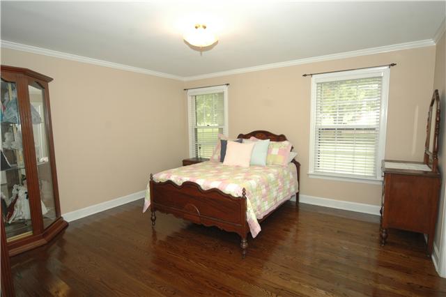4541 Peytonsville Road Franklin, TN 37064 - Photo 12 of 20 The guest bedroom has warm neutral colors and plenty of natural lighting.