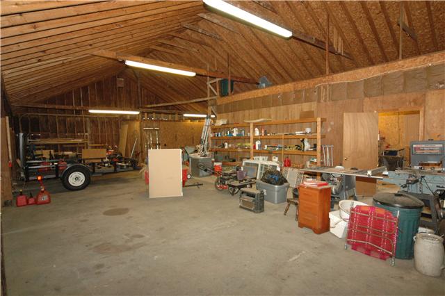 4541 Peytonsville Road Franklin, TN 37064 - Photo 19 of 20 Currently being used as storage, the main section of the barn has a poured concrete floor. The back section has a covered feeding station for your horses.