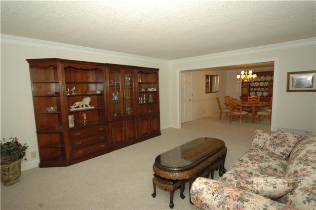 The oversized formal Living Room has dentil crown molding.