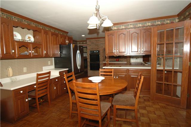 The eat-in kitchen also has a built-in desk and French doors leading to the Florida room.