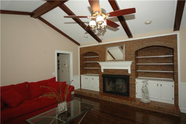 The Den is framed by a gas fireplace that can be converted back to wood burning. Vaulted ceiling, wainscoting, built-ins and recessed lighting make this the perfect retreat to wind down after a long day.