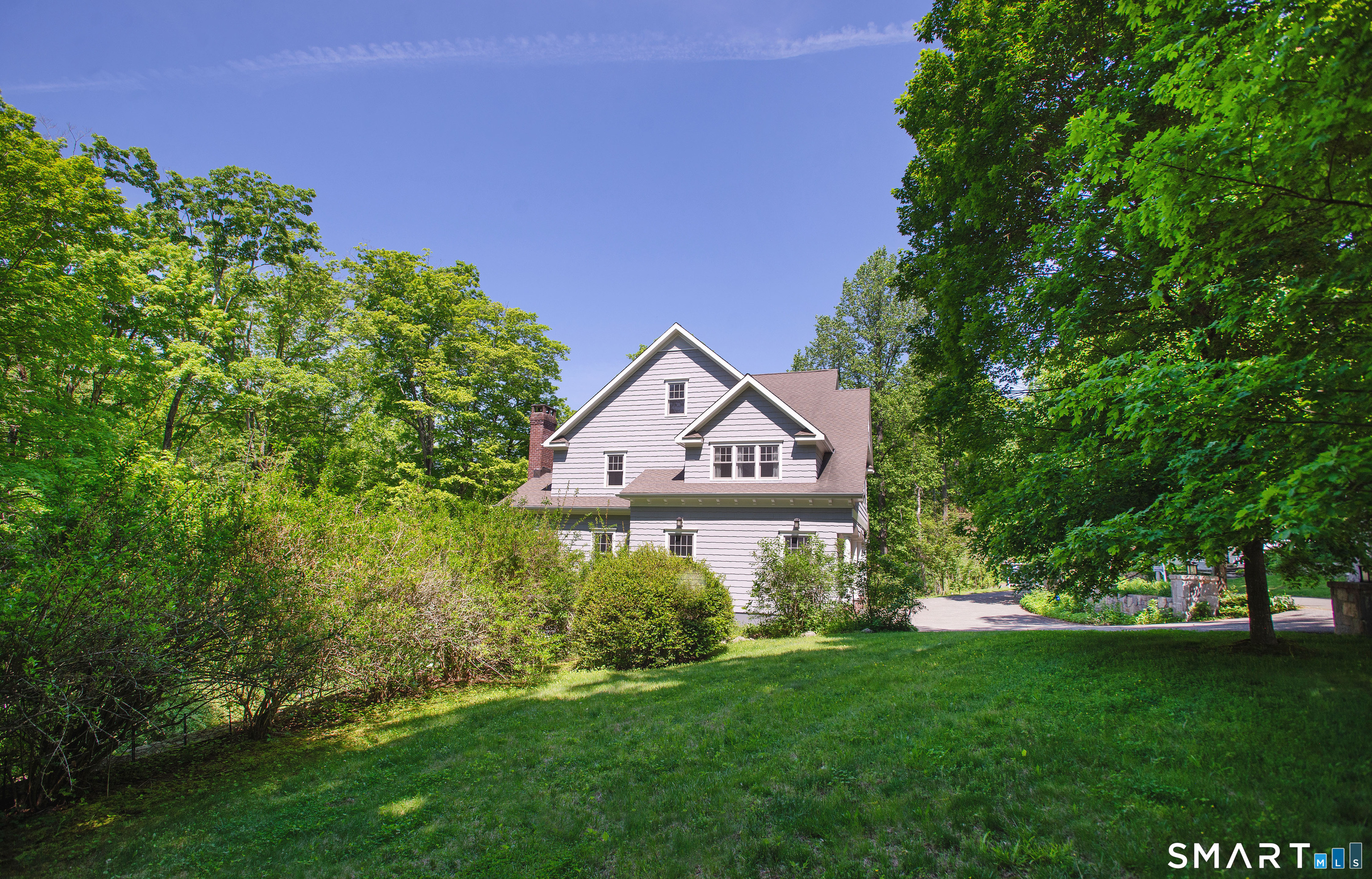 1 Spectacle Lane Ridgefield, CT 06877 - Photo 25 of 31 a sign board with a house and a yard in the back