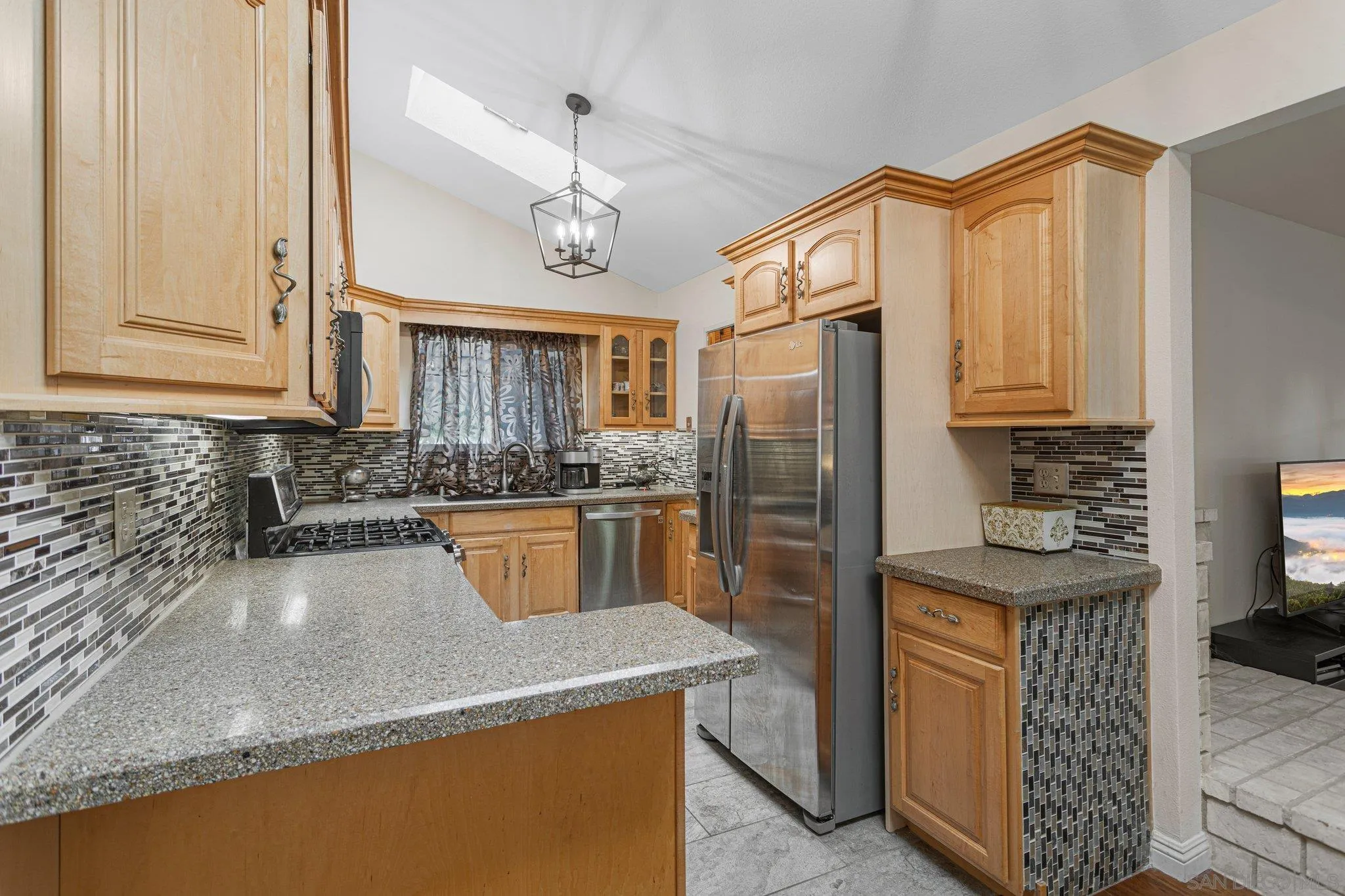 858 El Caminito Road Fallbrook, CA 92028 - Photo 7 of 28 a kitchen with stainless steel appliances granite countertop a sink a stove and a refrigerator
