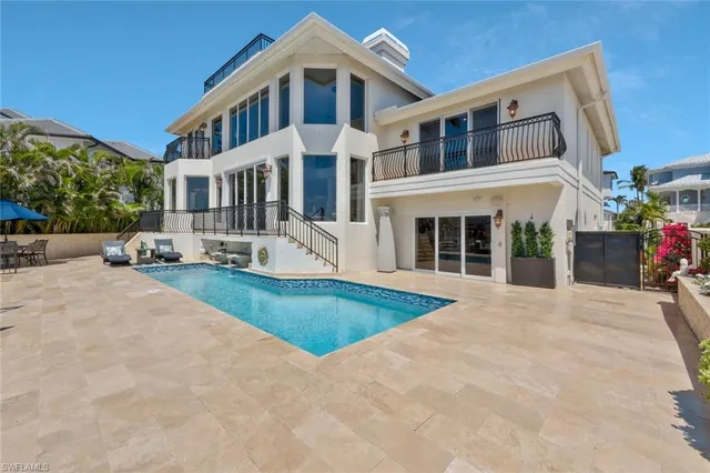 a view of a white building among the front of a building