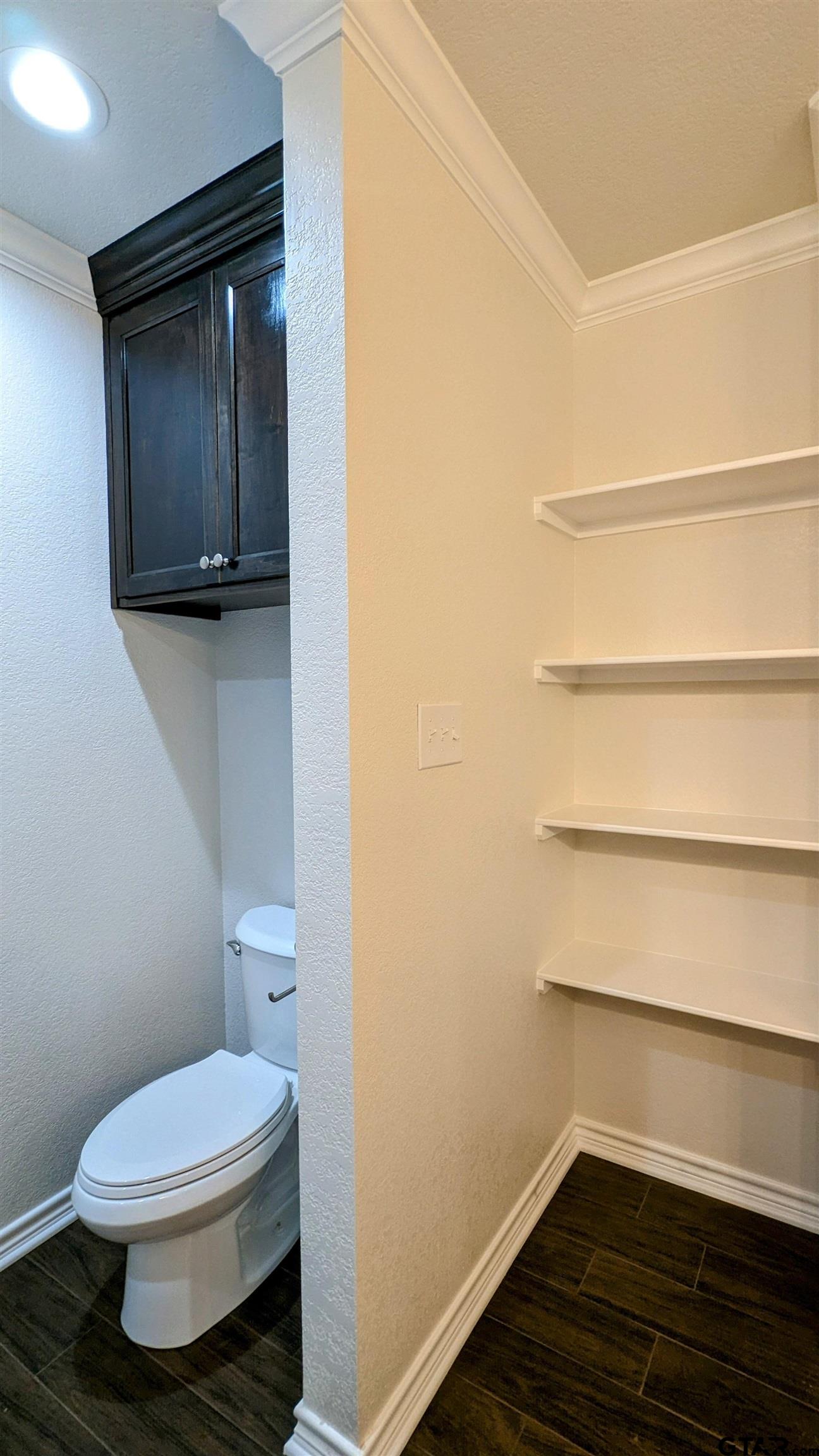 11086 County Road 167, Unit 11 Tyler, TX 75703 - Photo 12 of 20 a bathroom with a toilet and a vanity
