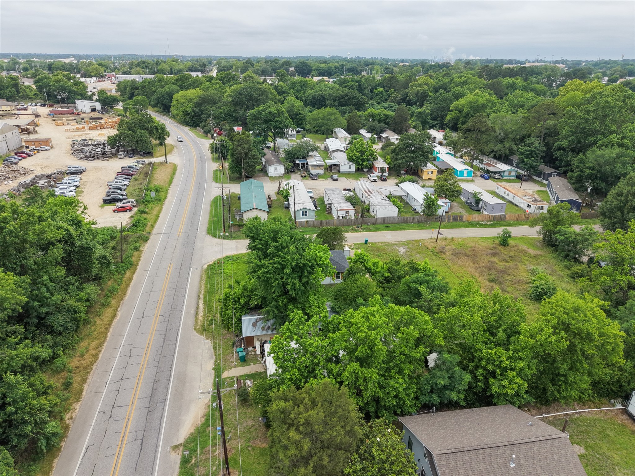 0 Mill Street Willis, TX 77378 - Photo 15 of 24 a view of a yard and front view of a house