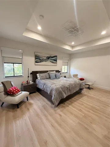 a bedroom with bed and window