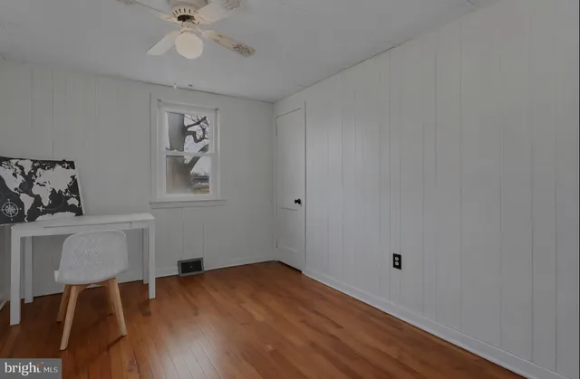 a kitchen with stainless steel appliances granite countertop a stove a sink dishwasher and a refrigerator with wooden cabinets