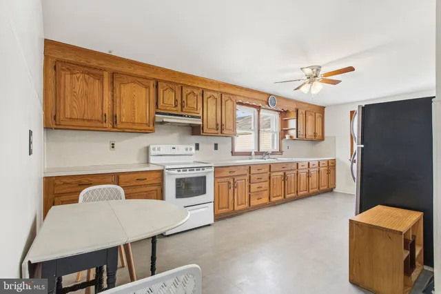 a bathroom with a sink a toilet and bathtub