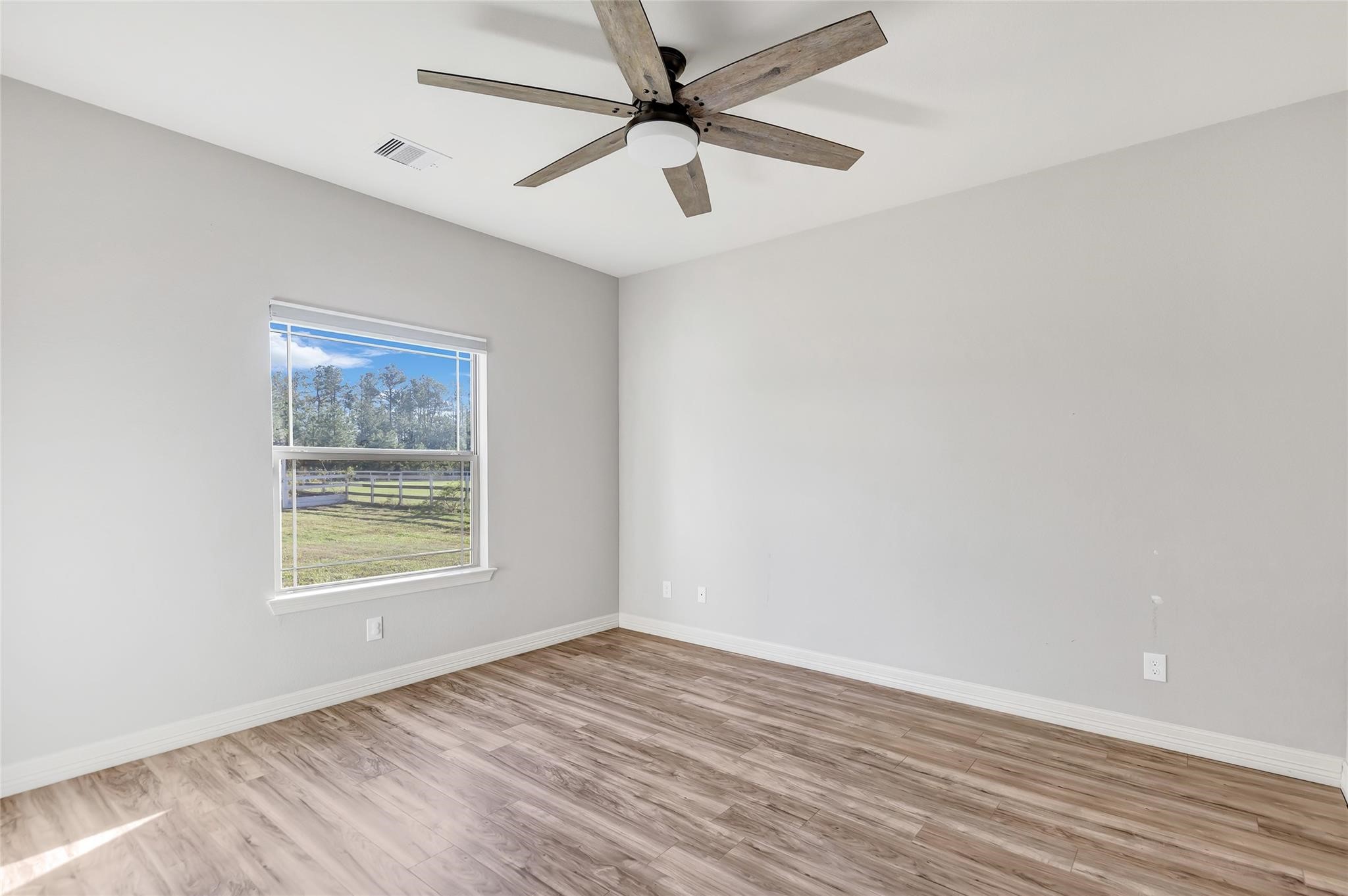 27684 Rio Blanco Drive Splendora, TX 77372 - Photo 16 of 37 an empty room with a window and a ceiling fan