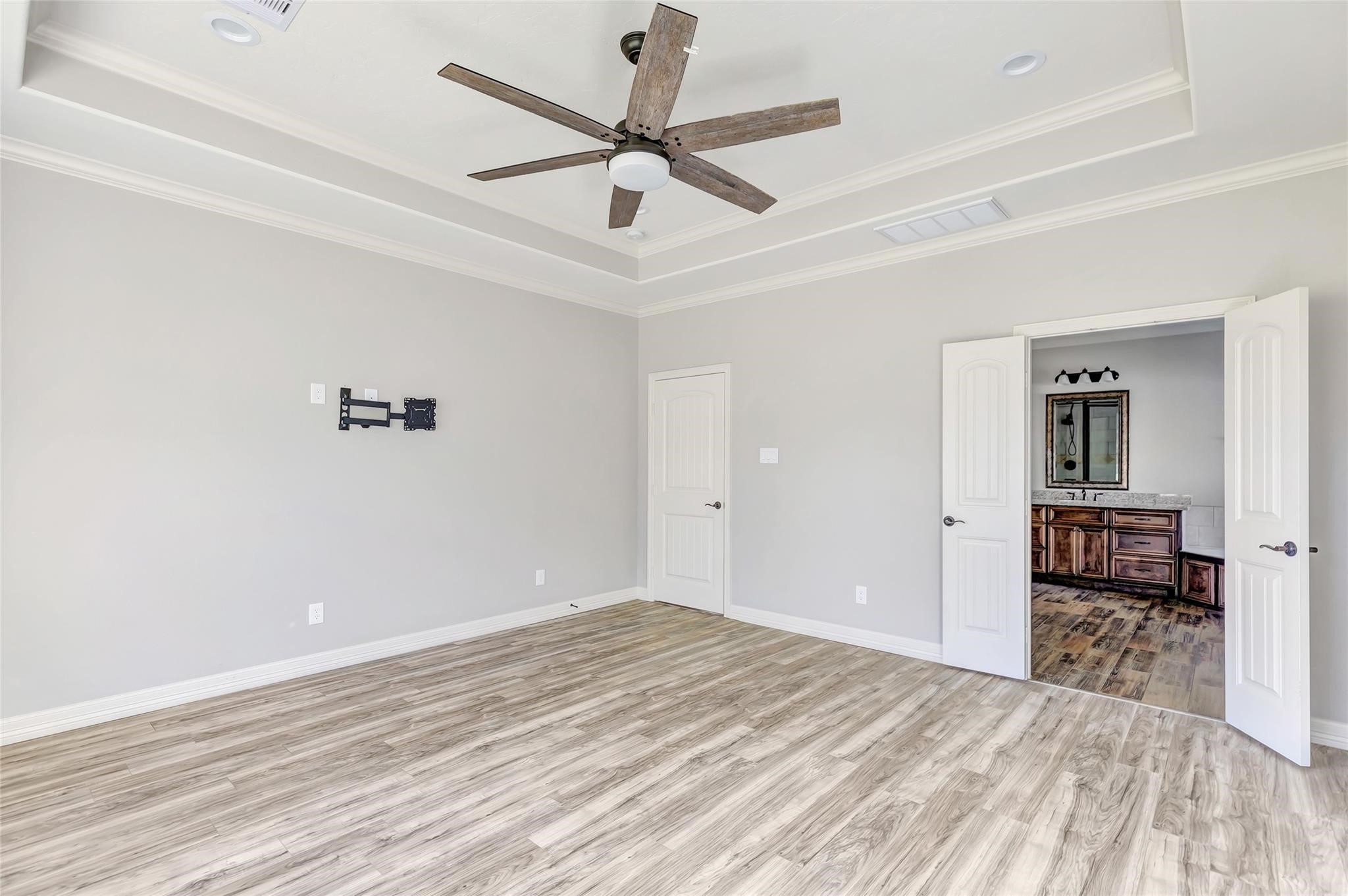 27684 Rio Blanco Drive Splendora, TX 77372 - Photo 21 of 37 a view of empty room with wooden floor and ceiling fan