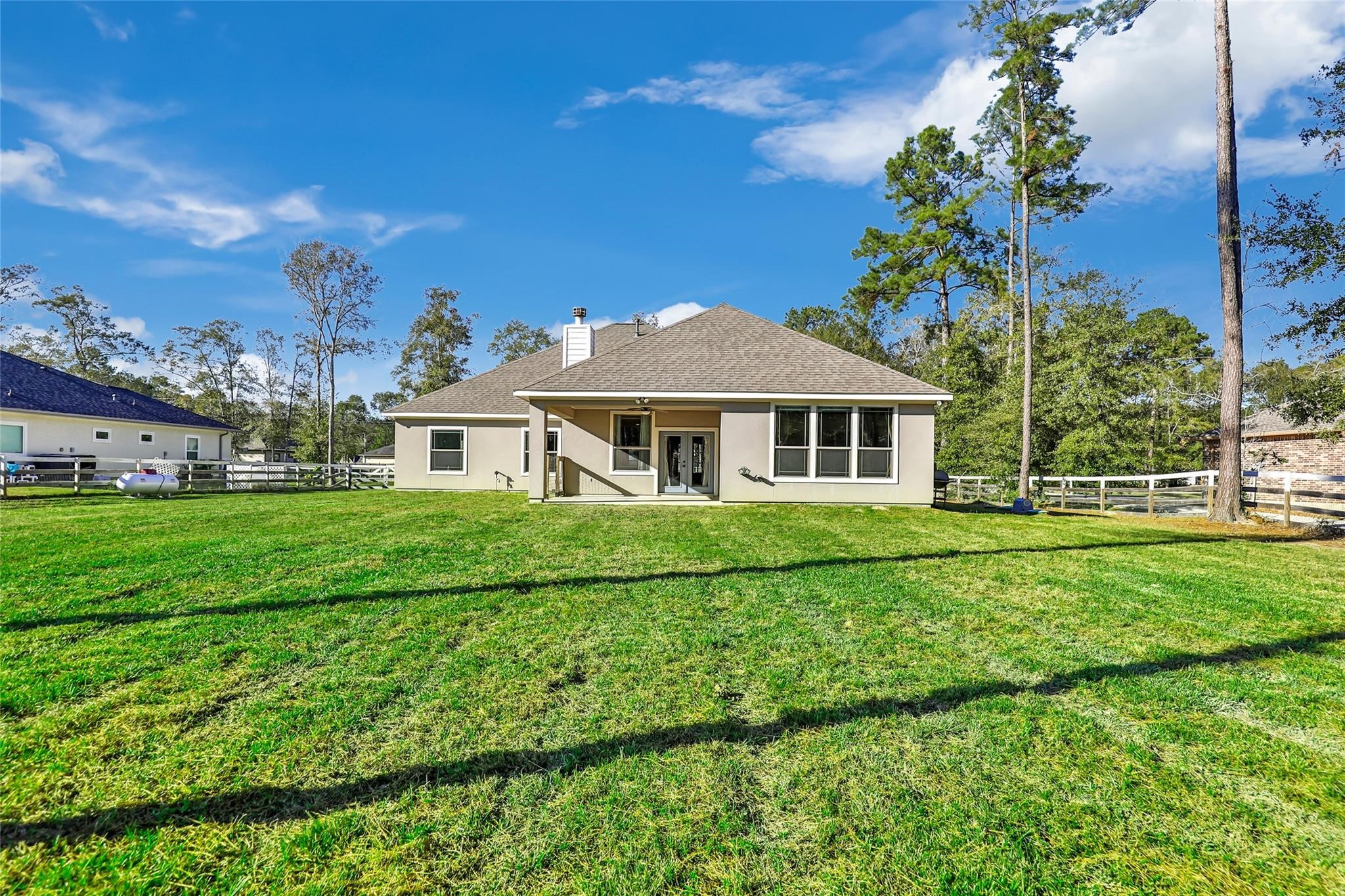27684 Rio Blanco Drive Splendora, TX 77372 - Photo 27 of 37 a front view of a house with a yard