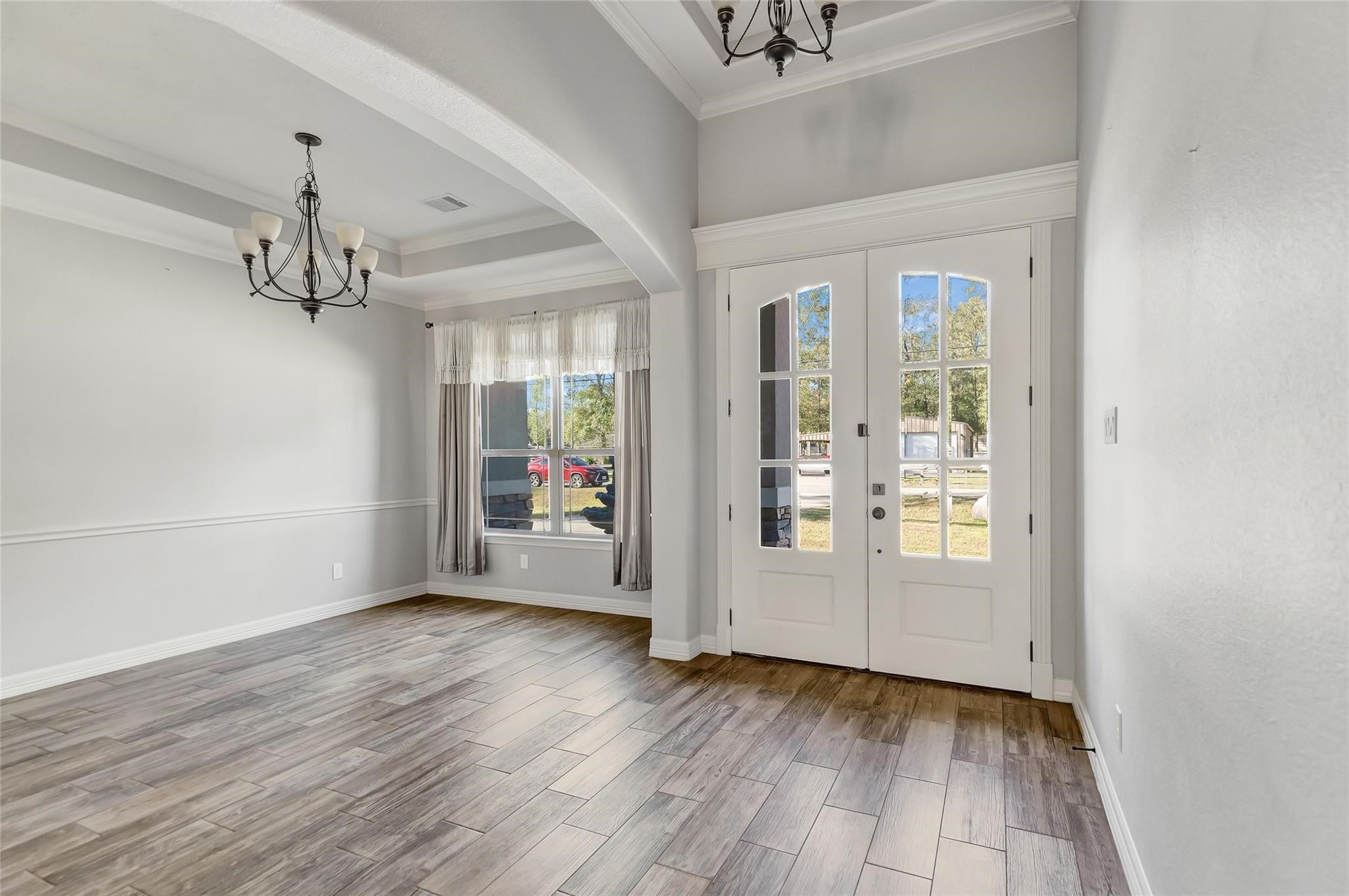 27684 Rio Blanco Drive Splendora, TX 77372 - Photo 3 of 37 an empty room with wooden floor and windows