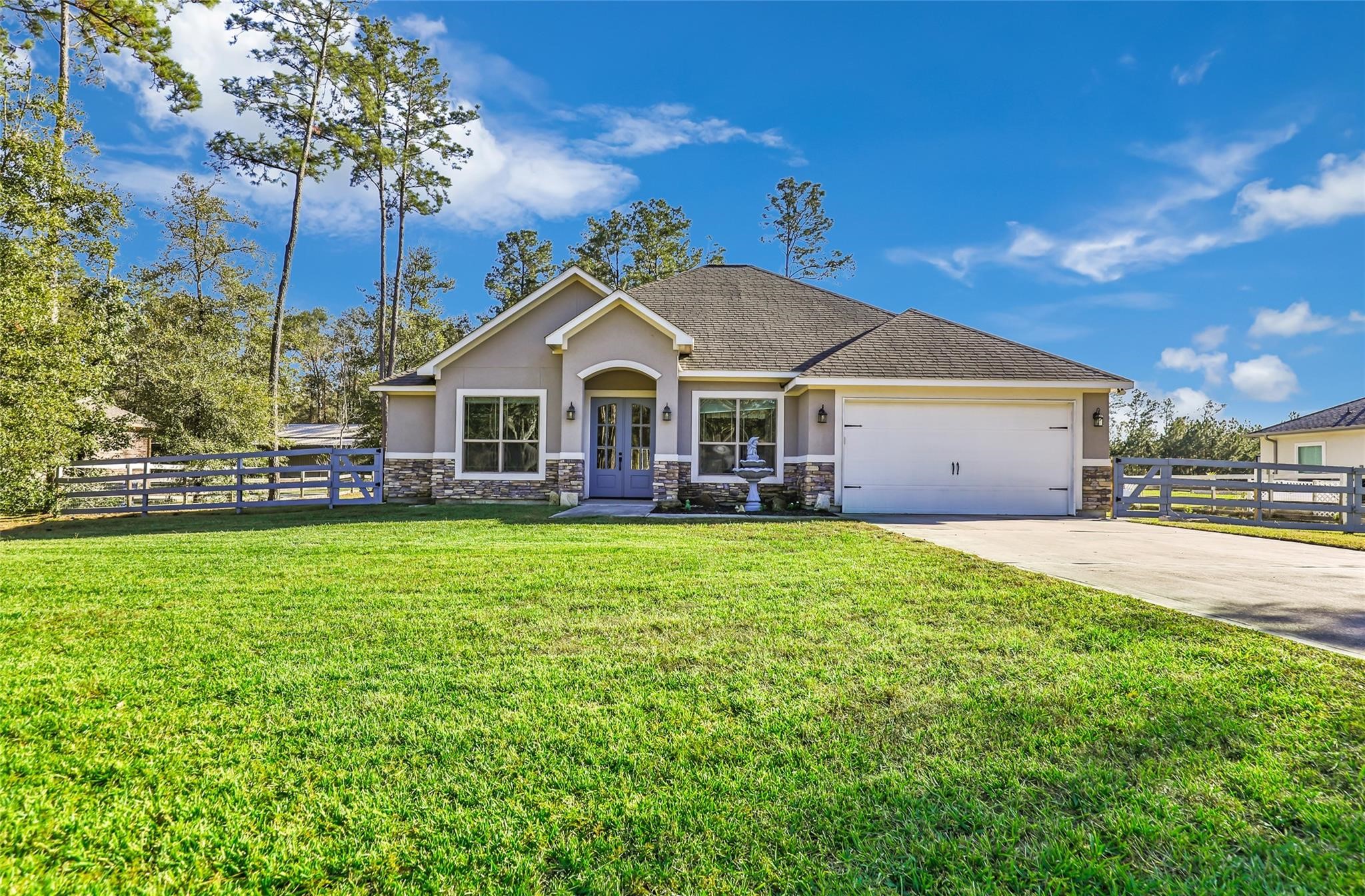 27684 Rio Blanco Drive Splendora, TX 77372 - Photo 36 of 37 a view of a house with a big yard and large trees