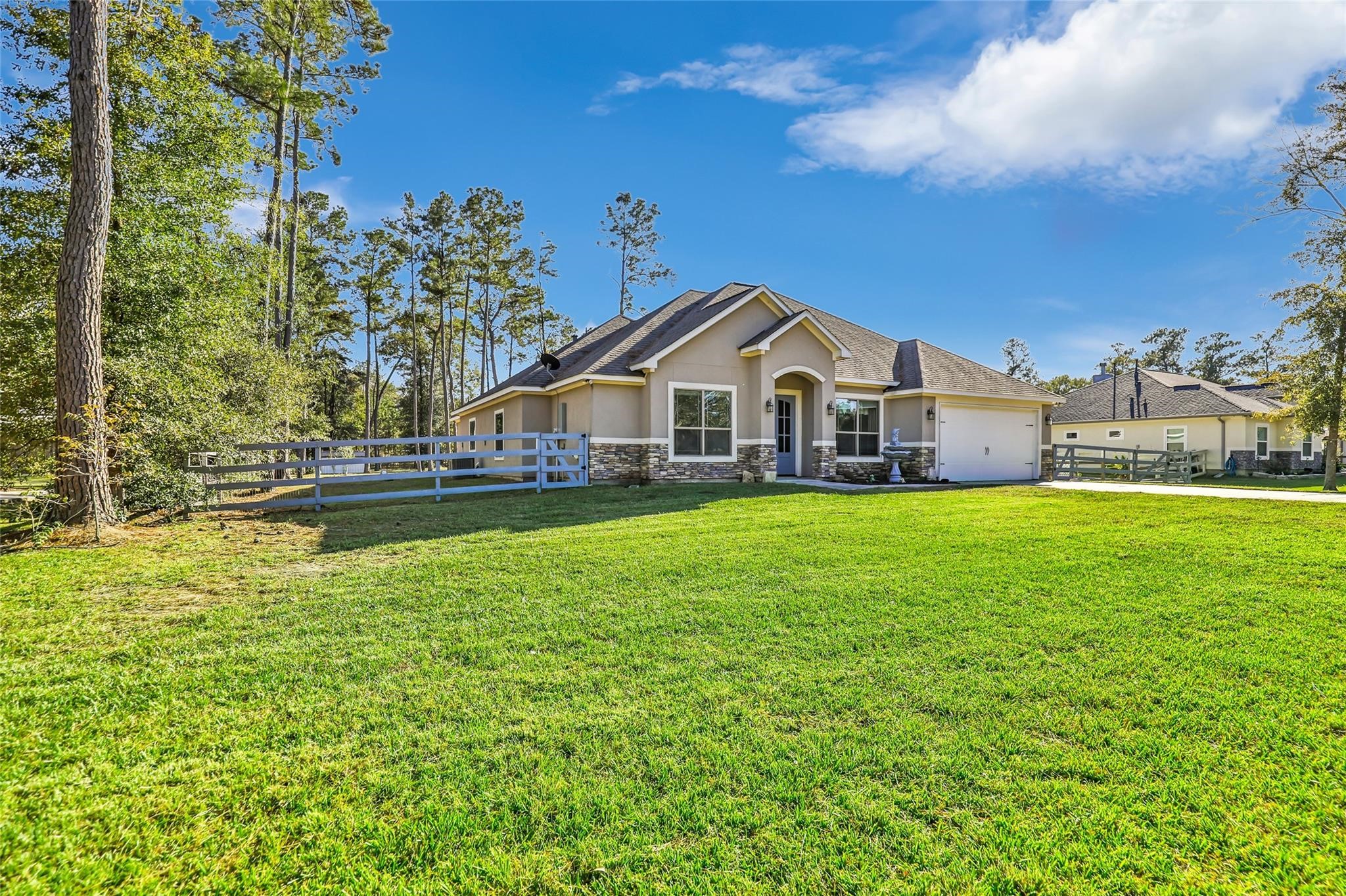 27684 Rio Blanco Drive Splendora, TX 77372 - Photo 37 of 37 a front view of a house with garden