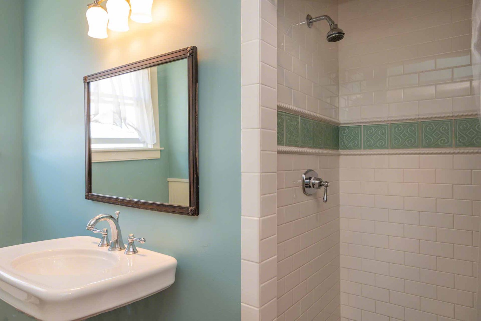 50 Red Pony Road Vineyard Haven, MA 02568 - Photo 16 of 28 a bathroom with a sink a mirror and shower