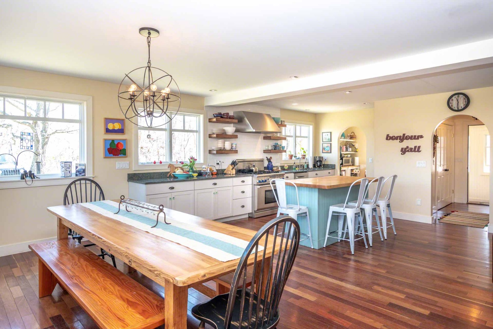 50 Red Pony Road Vineyard Haven, MA 02568 - Photo 7 of 28 a dining room with wooden floor a chandelier a wooden table and chairs