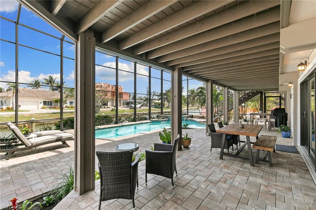 21531 Madera Road Fort Myers Beach, FL 33931 - Photo 26 of 49 a building outdoor space with patio furniture and garden