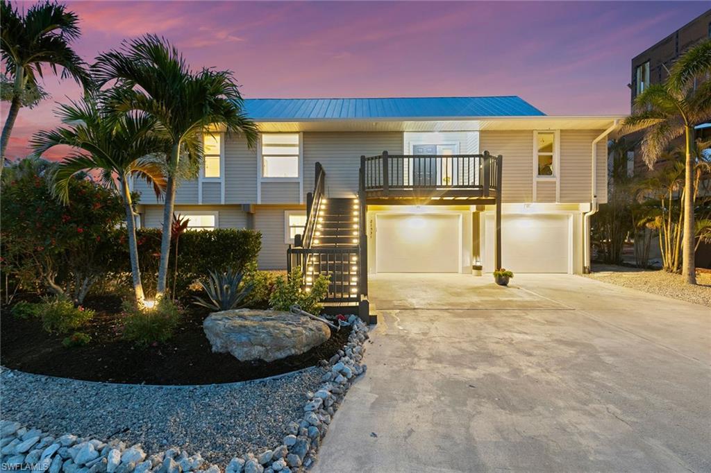 21531 Madera Road Fort Myers Beach, FL 33931 - Photo 3 of 49 a view of a back yard of the house
