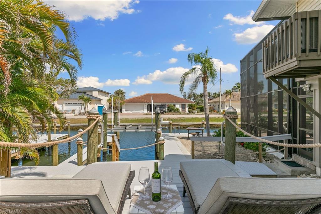 21531 Madera Road Fort Myers Beach, FL 33931 - Photo 34 of 49 a view of a patio with swimming pool