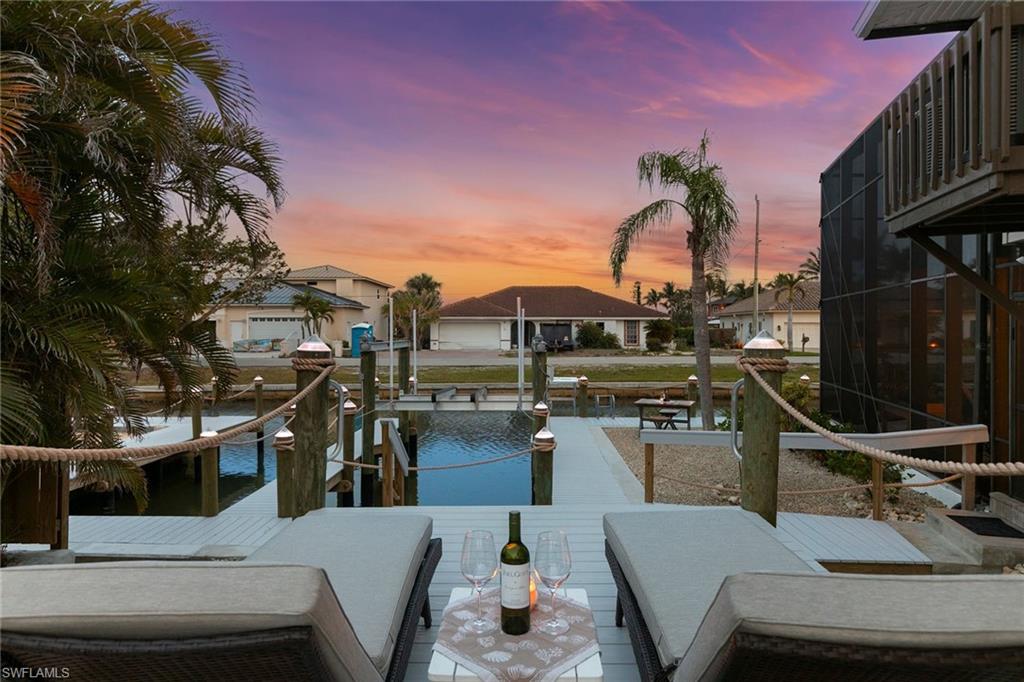 21531 Madera Road Fort Myers Beach, FL 33931 - Photo 35 of 49 a view of a patio with swimming pool