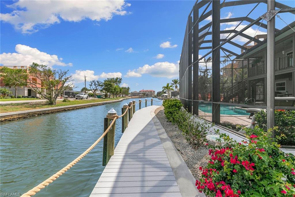 21531 Madera Road Fort Myers Beach, FL 33931 - Photo 40 of 49 a view of a lake with a sitting space