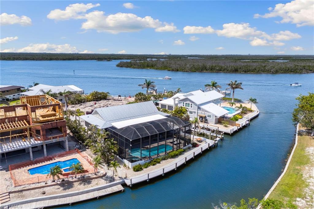 21531 Madera Road Fort Myers Beach, FL 33931 - Photo 45 of 49 a view of a terrace with chairs