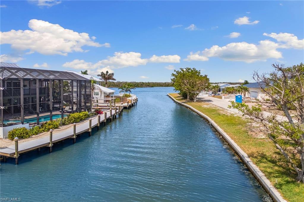 21531 Madera Road Fort Myers Beach, FL 33931 - Photo 46 of 49 a view of ocean with a nearby beach