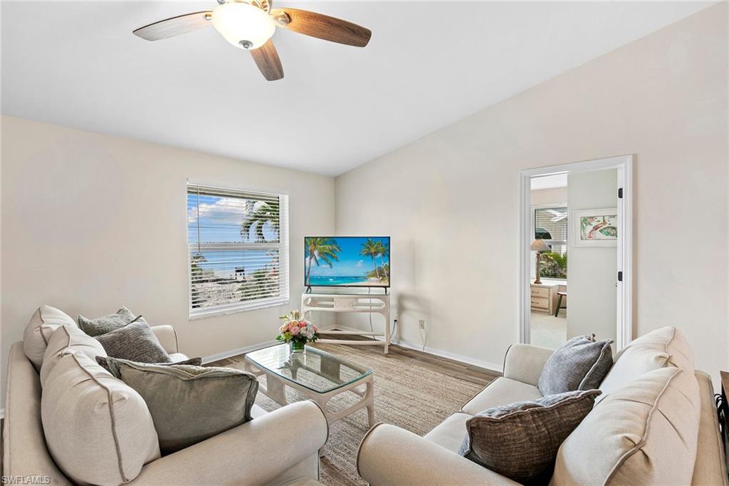 21531 Madera Road Fort Myers Beach, FL 33931 - Photo 5 of 49 a living room with furniture and a flat screen tv