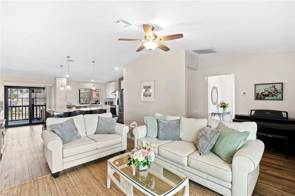 21531 Madera Road Fort Myers Beach, FL 33931 - Photo 6 of 49 a living room with furniture and kitchen view